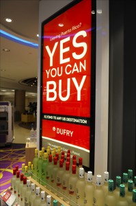 Dufry signage assure passengers traveling to the U.S. mainland that they can buy duty free at the airport.