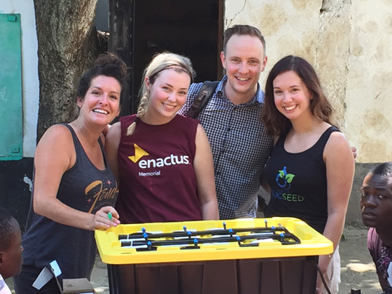 Guay with Linsey Jorgenson, Streethearts Founder/Executive Director, who lives with the children on a full-time basis, with Memorial University students and one of the state-of-the-art hydroponic systems produced by Enactus and SucSeed. 