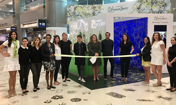 Chicago artists Petra Bachmaier (left) and Sean Gallero (Luftwerk) with Pernod Ricard’s Paola Pinto at the ribbon cutting for the opening of the 2017 of the Perrier-Jouët pop-up installation at Miami International Airport on Dec. 4. 